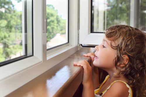 Girl looking out a replacement window